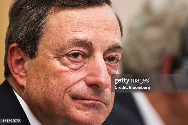 Mario Draghi, president of the European Central Bank , pauses during a news conference at the Spanish Congress in Madrid, Spain, on Tuesday, Feb. 12,...