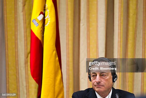 Mario Draghi, president of the European Central Bank , pauses during a news conference at the Spanish Congress in Madrid, Spain, on Tuesday, Feb. 12,...