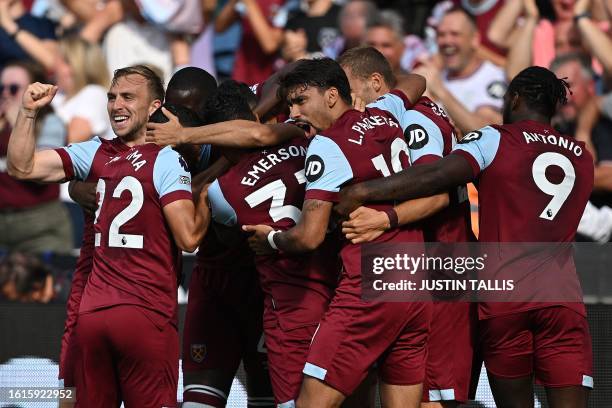 West Ham's players celebrate their opening goal during the English Premier League football match between West Ham United and Chelsea at the London...