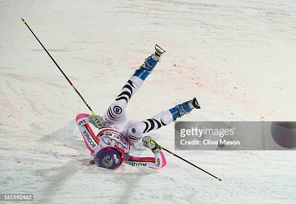 Maria Hoefl-Riesch of Germany falls while skiing in the Men and Women's Nations Team Event during the Alpine FIS Ski World Championships on February...