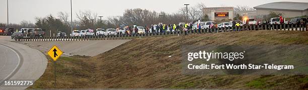 People line up along US 287 to pay their respects to Chris Kyle in Midlothian, Texas, Tuesday, February 12, 2013. A motorcade of about 200 vehicles...