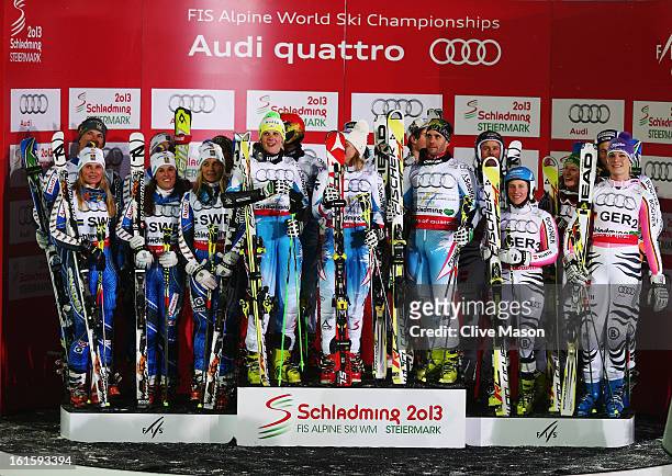 The Austrian team of Nicole Hosp, Michaela Kirchgasser, Carmen Thalmann, Marcel Hirscher, Marcel Mathis and Philipp Schoerghofer celebrate victory...