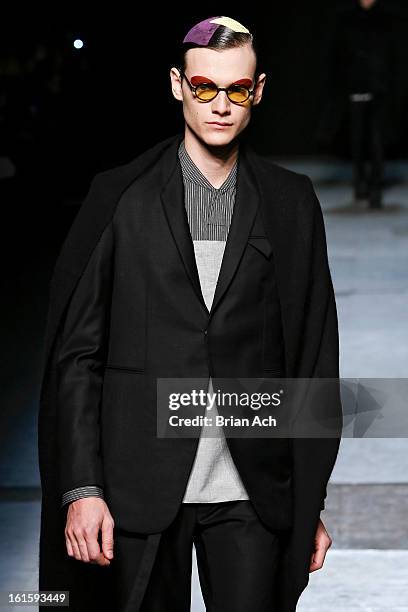 Model walks the runway at the Siki Im fashion show during Fall 2013 Mercedes-Benz Fashion Week at Cafe Rouge on February 12, 2013 in New York City.