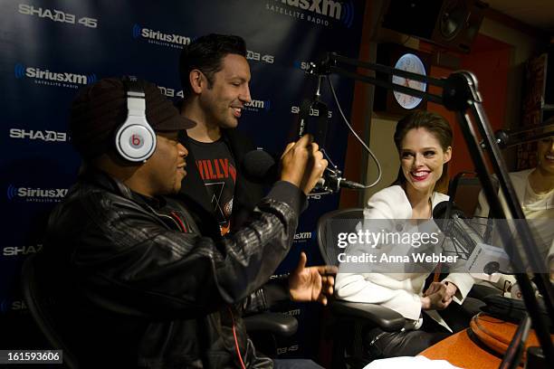 Models Coco Rocha and Karolina Kurkova pose with the host of Shade 45 Sirius XM morning show Sway Calloway at SiriusXM Studios on February 12, 2013...