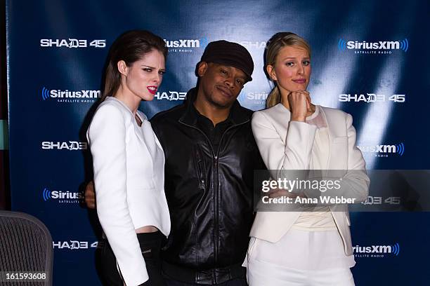 Models Coco Rocha and Karolina Kurkova pose with the host of Shade 45 Sirius XM morning show Sway Calloway at SiriusXM Studios on February 12, 2013...