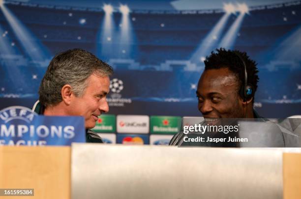 Head coach Jose Mourinho of Real Madrid chats with his player Michael Essien during a press conference ahead of the UEFA Champions League match...