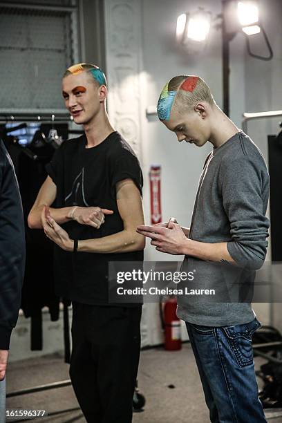 Models prepare backstage at the Siki Im Fall 2013 fashion show during Mercedes-Benz Fashion Week at Cafe Rouge on February 12, 2013 in New York City.