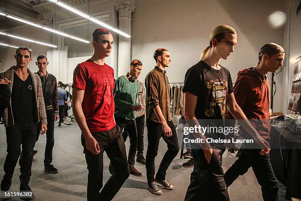 Models prepare backstage at the Siki Im Fall 2013 fashion show during Mercedes-Benz Fashion Week at Cafe Rouge on February 12, 2013 in New York City.