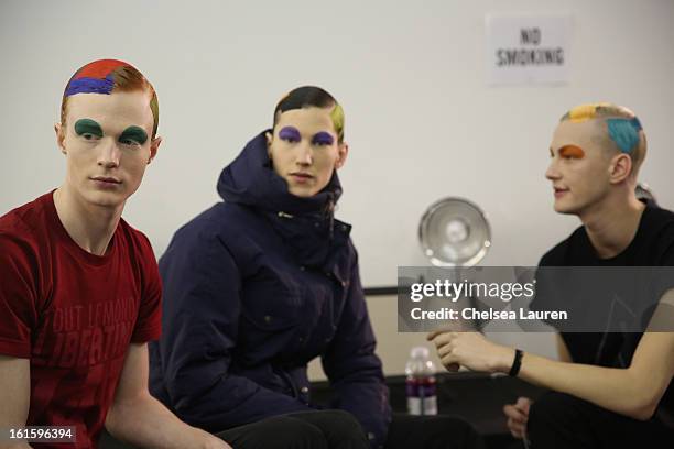 Models prepare backstage at the Siki Im Fall 2013 fashion show during Mercedes-Benz Fashion Week at Cafe Rouge on February 12, 2013 in New York City.