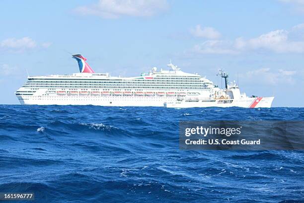 In this handout from the U.S. Coast Guard, the cruise ship Carnival Triumph sits idle February 11, 2013 in the Gulf of Mexico. According to the Coast...