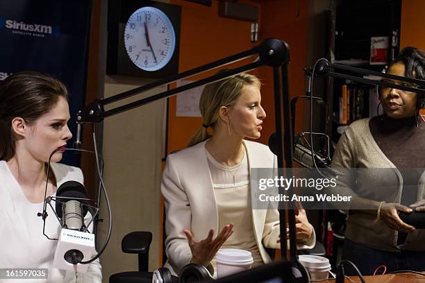 Models Coco Rocha and Karolina Kurkova pose with the host of Shade 45 Sirius XM morning show Sway Calloway at SiriusXM Studios on February 12, 2013...