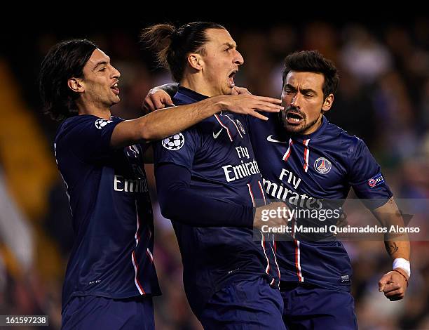 Ezequiel Lavezzi of Paris Saint-Germain celebrates scoring with his team-mate Zlatan Ibrahimovic and Javier Pastore during the UEFA Champions League...