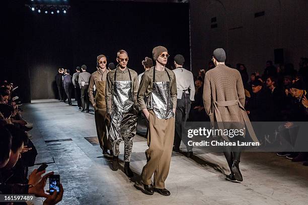 Models walk in the Siki Im fall 2013 fashion show during Mercedes-Benz Fashion Week at Cafe Rouge on February 12, 2013 in New York City.