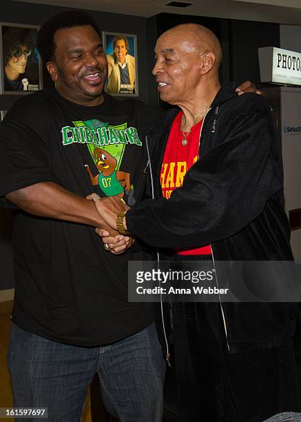 Actor Craig Robinson and Harlem Globe Trotter Curly Neal visit SiriusXM Studios on February 12, 2013 in New York City.