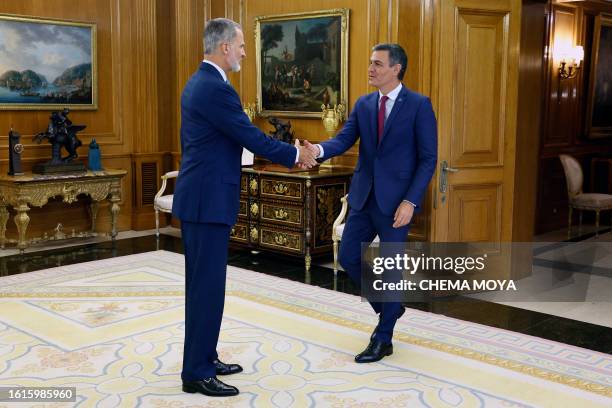 Spain's King Felipe VI receives Spain's acting Prime Minister Pedro Sanchez as part of the round of consultations with political representatives...