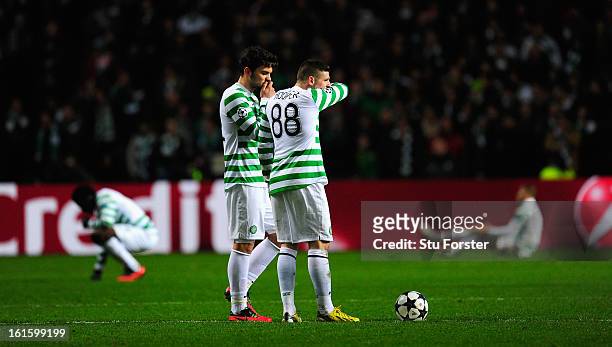 Celtic players Anthony Watt and Gary Hooper look on dejectedly after the third Juventus goal during the UEFA Champions League Round of 16 first leg...