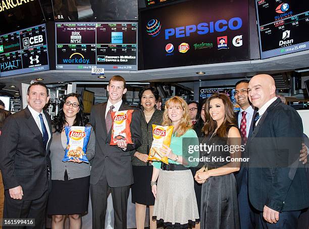 Brian Cornell, Christina Abu-Judom, Tyler Raineri, Indra Nooyi, Karen Weber-Mendham, Eva Longoria and Michael Simon pose for a photo during the NYSE...