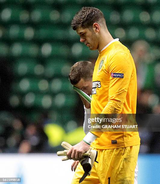 Celtic's Welsh defender Adam Matthews and English goalkeeper Fraser Forster leave the field after losing 3-0 to Juventus in the UEFA Champions League...