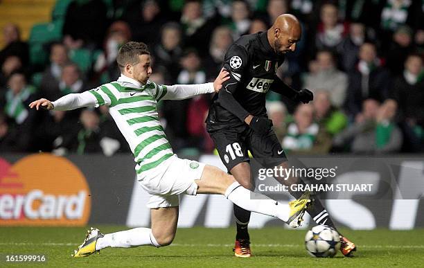 Celtic's Welsh defender Adam Matthews vies with Juventus's French striker Nicolas Anelka during the UEFA Champions League last sixteen football match...