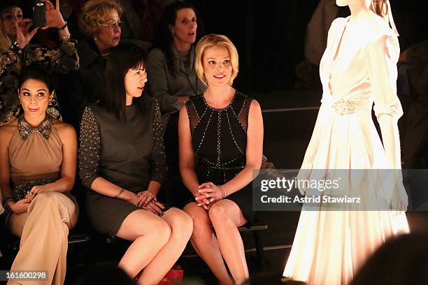 Actress Vanessa Hudgens, guest, and actress Katherine Heigl attend the TRESemme At Jenny Packham Fall 2013 fashion show during Mercedes-Benz Fashion...