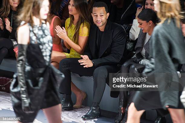 Model Chrissy Teigen and musician John Legend attend Vera Wang during fall 2013 Mercedes-Benz Fashion Week at The Stage at Lincoln Center on February...
