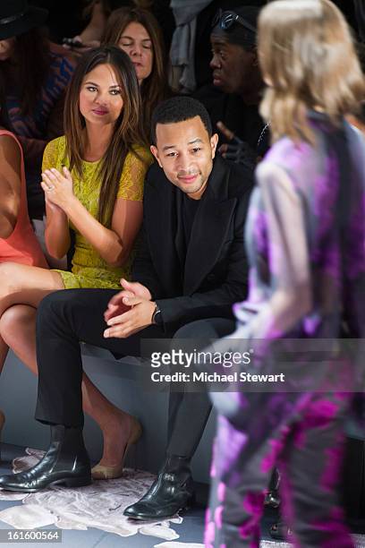 Model Chrissy Teigen and musician John Legend attend Vera Wang during fall 2013 Mercedes-Benz Fashion Week at The Stage at Lincoln Center on February...