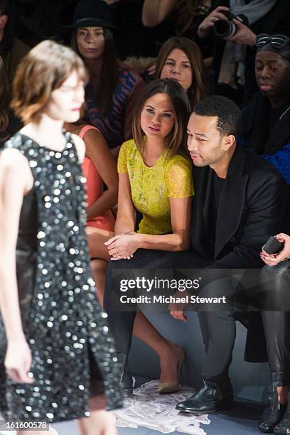 Model Chrissy Teigen and musician John Legend attend Vera Wang during fall 2013 Mercedes-Benz Fashion Week at The Stage at Lincoln Center on February...