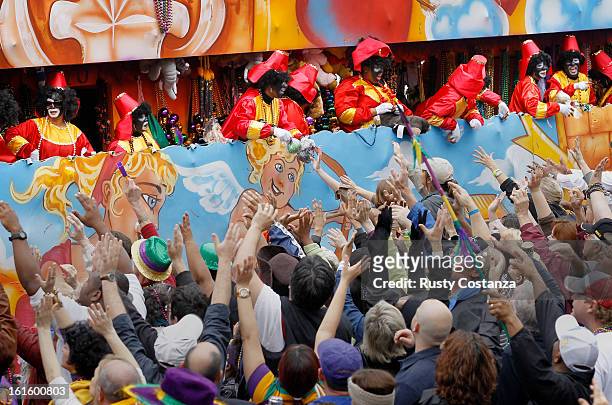 Riders in the Krewe of Zulu parade toss beads to the crowd below on Canal Street in New Orleans on Mardi Gras Day. Fat Tuesday, the traditional...