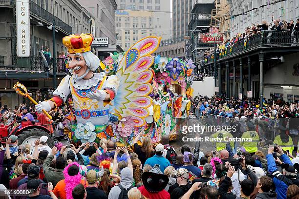 Float in the Rex parade turns on to Canal Street to large crowds with out outstretched arms on Mardi Gras Day. Fat Tuesday, the traditional...