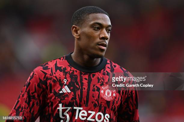 Anthony Martial of Manchester United warms up ahead of the Premier League match between Manchester United and Wolverhampton Wanderers at Old Trafford...