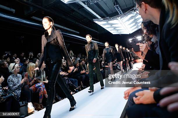 Model walks the runway at the Diesel Black Gold Fall 2013 fashion show during Mercedes-Benz Fashion Week at Pier 57 on February 12, 2013 in New York...