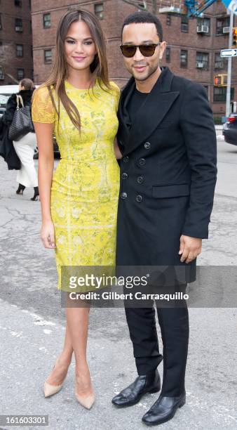 Model Chrissy Teigen and singer John Legend attend Fall 2013 Mercedes-Benz Fashion Show at The Theater at Lincoln Center on February 12, 2013 in New...