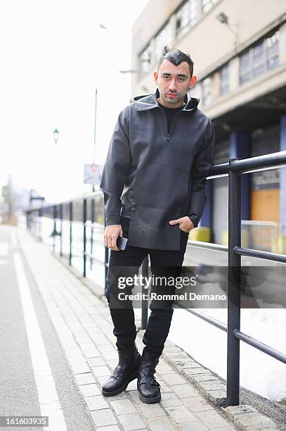 Nicola Formichetti, Fashion Director of Mugler, seen outside the Diesel Black Gold show wearing Mugler jacket, Diesel pants and Mugler shoes on...