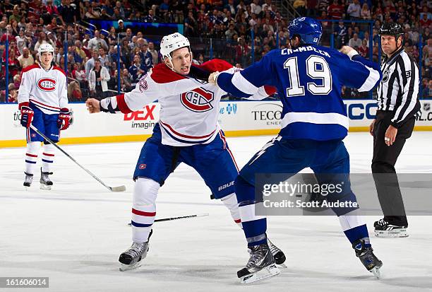 Travis Moen of the Montreal Canadiens fights with B.J. Crombeen of the Tampa Bay Lightning during the second period of the game at the Tampa Bay...