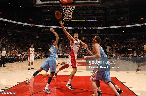 Landry Fields of the Toronto Raptors goes up for the awkward layup against the Denver Nuggets during the game on February 12, 2013 at the Air Canada...