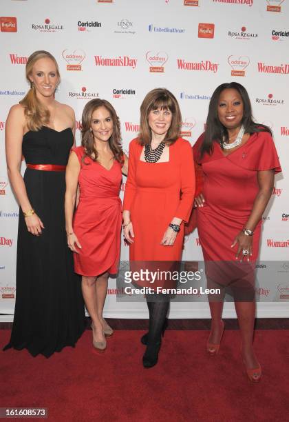 Olympic swimmer Dana Vollmer, NBC's Joy Bauer, AHA CEO Nancy Brown and TV Personality Star Jones pose for a photo as they attend the Woman's Day Red...