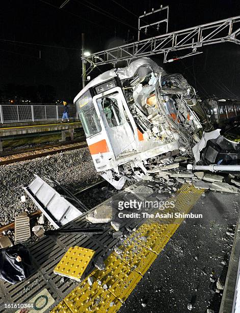 The lead vehicle of the derailed Sanyo Electric Railway Co. Train is seen after a collision with a truck at Arai Station on February 12, 2013 in...