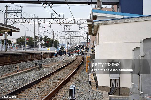 Derailed Sanyo Electric Railway Co. Train is seen after a collision with a truck at Arai Station on February 12, 2013 in Takasago, Hyogo, Japan....