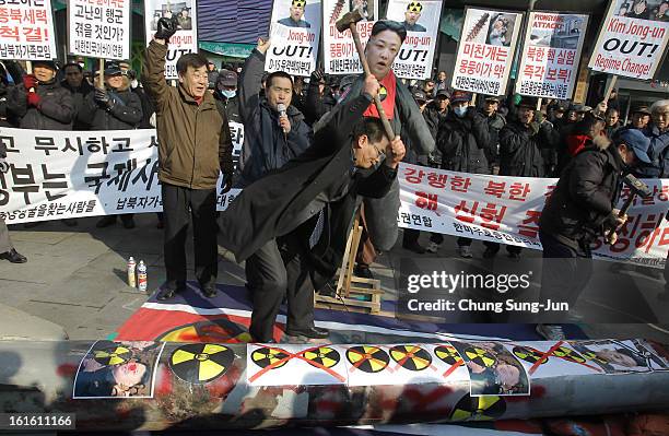 South Korean conservative protesters participate in a rally a day after North Korea announced they have conducted a third nuclear test on February...