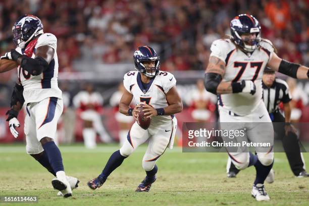 Quarterback Russell Wilson of the Denver Broncos drops back to pass during the NFL game at State Farm Stadium on August 11, 2023 in Glendale,...