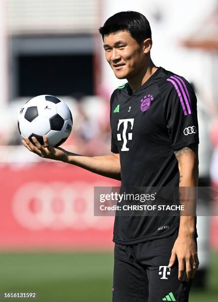 Bayern Munich's South Korean defender Kim Min-jae attends a public training session at the club's grounds in Munich, southern Germany, on August 22,...