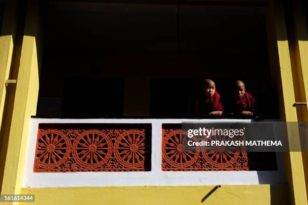 Young Tibetan monks in exile observe prayers marking the third day of Losar, the Tibetan new year, in Kathmandu on February 13, 2013. A Tibetan monk...
