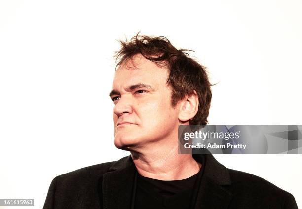 Director Quentin Tarantino poses for photos before the special screening of 'Django Unchained' at Shinjuku Piccadilly on February 13, 2013 in Tokyo,...