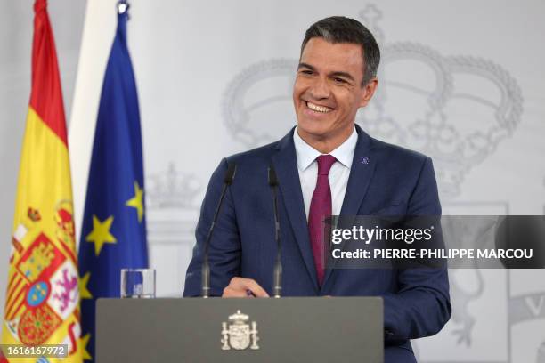 Spain's acting Prime Minister Pedro Sanchez reacts during a press conference after meeting with the King as part of the round of consultations with...