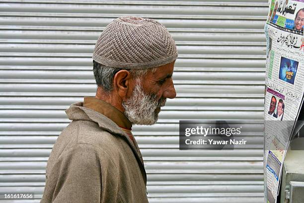 Kashmiri Muslim man reads a newspaper following a four-day media gagging order imposed after the execution of alleged Indian parliament attacker...