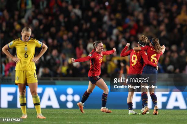 Eva Navarro, Aitana Bonmati and Esther Gonzalez of Spain celebrate the team’s 2-1 victory and advance to the final following during the FIFA Women's...