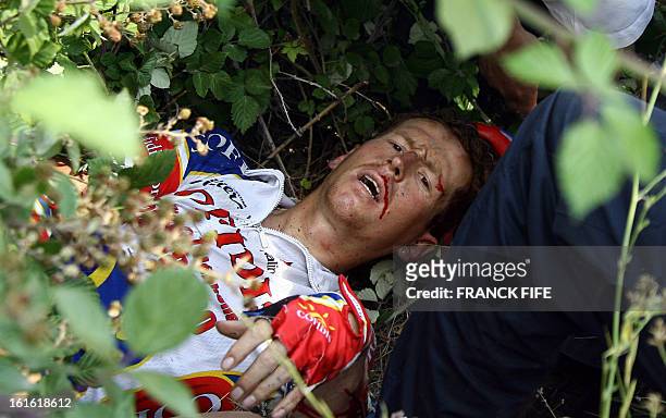 Belgium's Rik Verbrugghe lays on the ground after a fall during the 180.5 km fourteenth stage of the 93rd Tour de France cycling race from Montelimar...