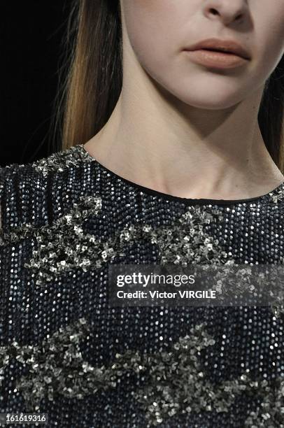 Model walks the runway at the Theyskens' Theory Ready to Wear Fall/Winter 2013-2014 fashion show during Mercedes-Benz Fashion Week at Skylight at...