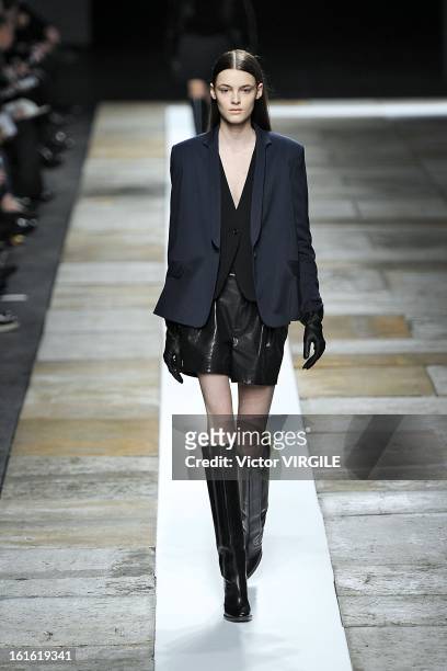 Model walks the runway at the Theyskens' Theory Ready to Wear Fall/Winter 2013-2014 fashion show during Mercedes-Benz Fashion Week at Skylight at...