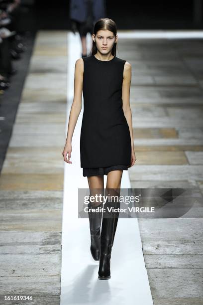 Model walks the runway at the Theyskens' Theory Ready to Wear Fall/Winter 2013-2014 fashion show during Mercedes-Benz Fashion Week at Skylight at...